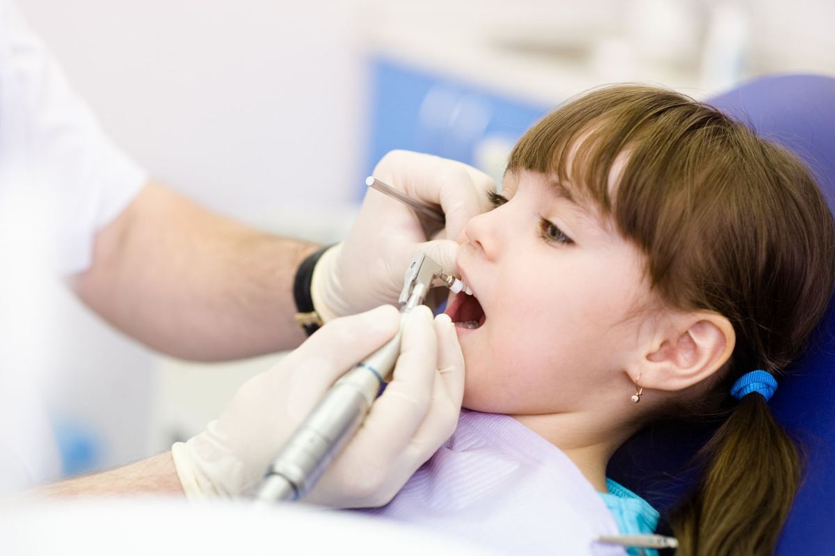 Young patient receiving gentle dental care